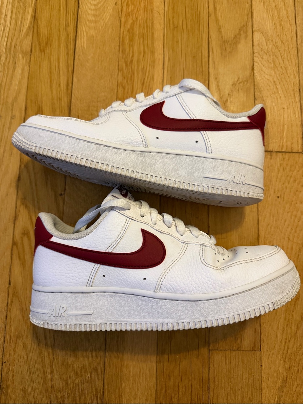 Nike Kids White Sneakers with Red Swoosh Accent